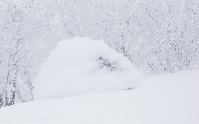 Kelsey rides deep untracked fresh during the heart of the snowstorm yesterday.