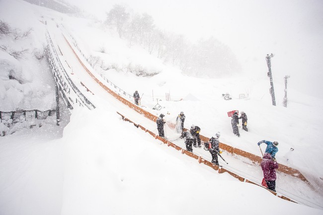 Clearing the big ski jump for competition.