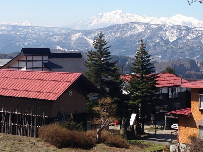 Looking over Kaiya Nozawa Lodge to Mt Myoko and Hiuchi in the back ground in Nozawa