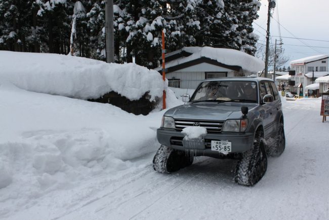 These guys will deliver anywhere, anytime the Black Cat delivery service on the snow in Nozawa near Mt Dock 