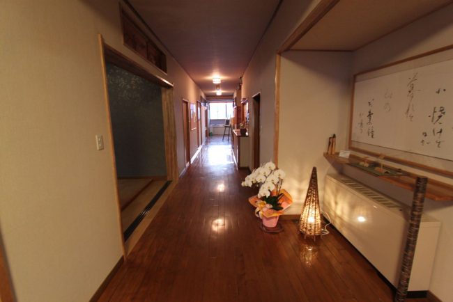 The entrance to Maruji lodge in Nozawa where you are always assured a warm welcome