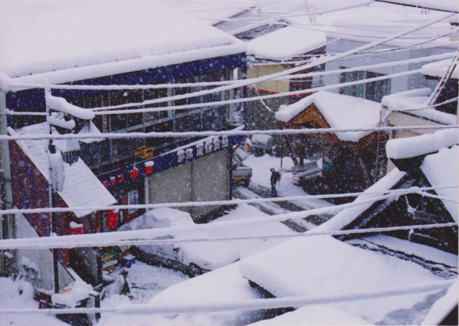 Taken from Tomii Ken looking down on the main street of Nozawa in 1991