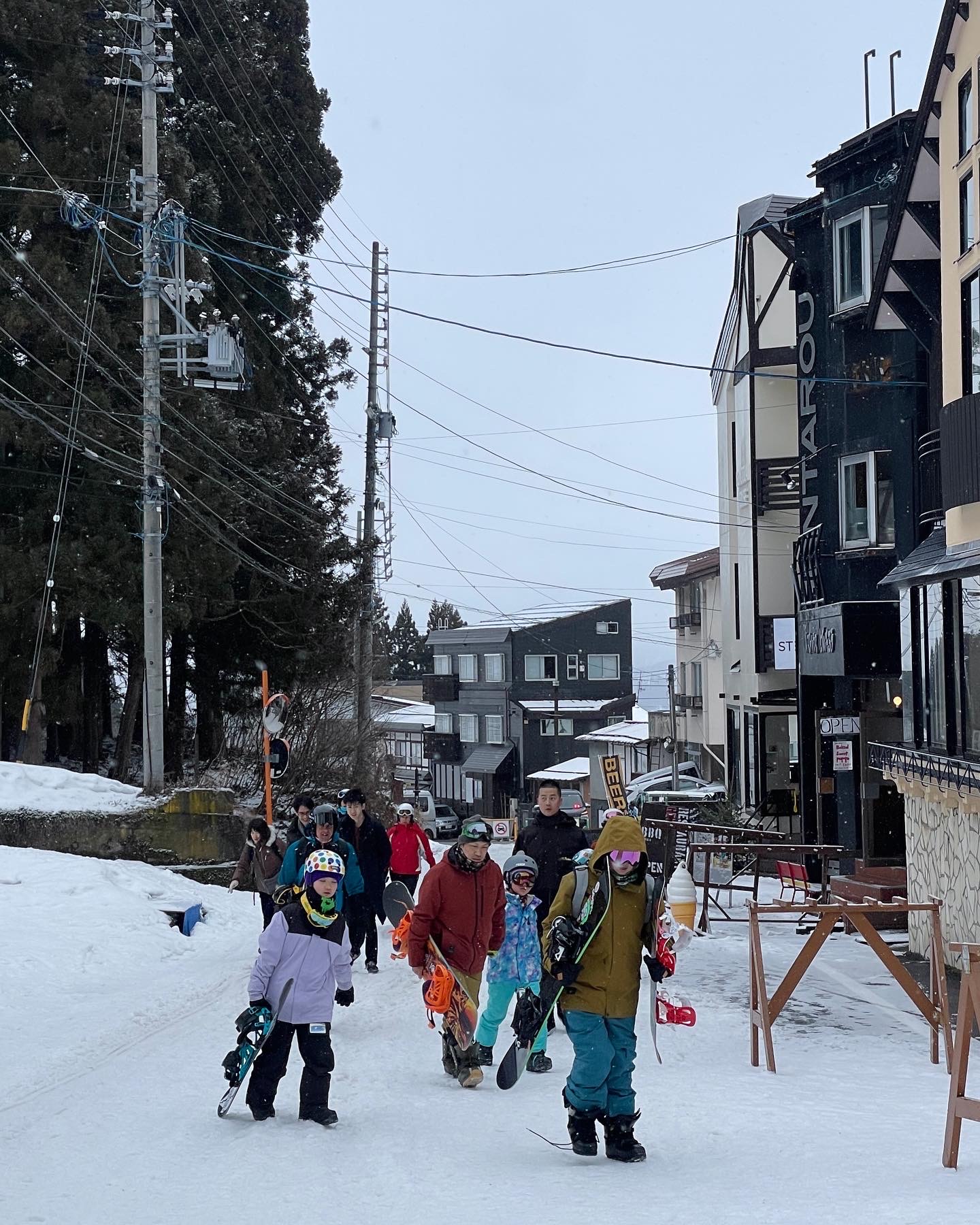 Early birds heading to Nagasaka Station in Nozawa Onsen to enjoy their day on the mountain