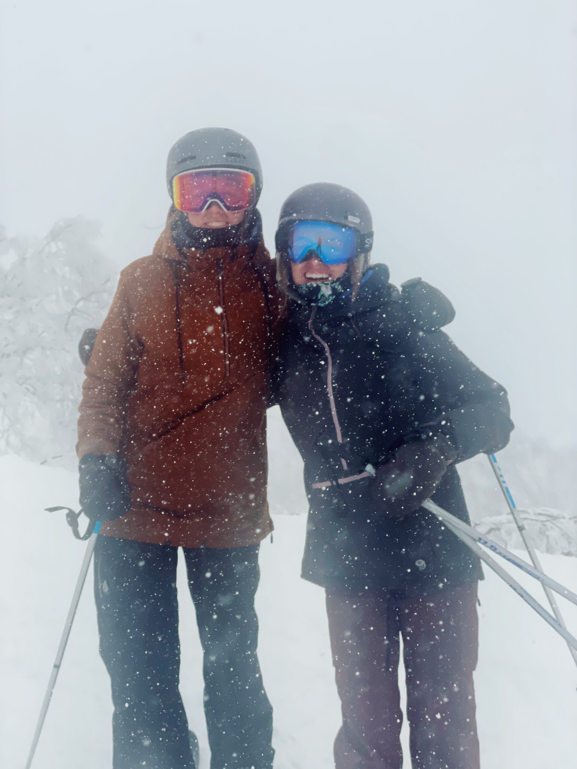 Skiers and snowboarders in heavy snow up on Mt. Kenashi's Yamabiko course