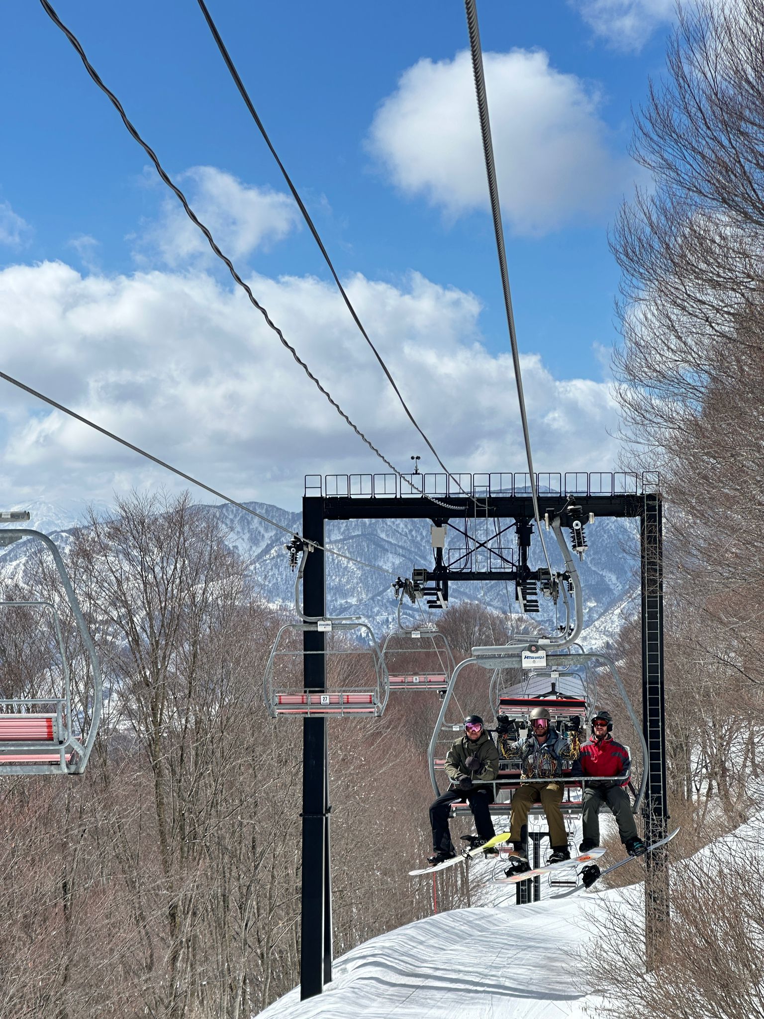 3 of kaiya nozawa lodges guests on the chairlift