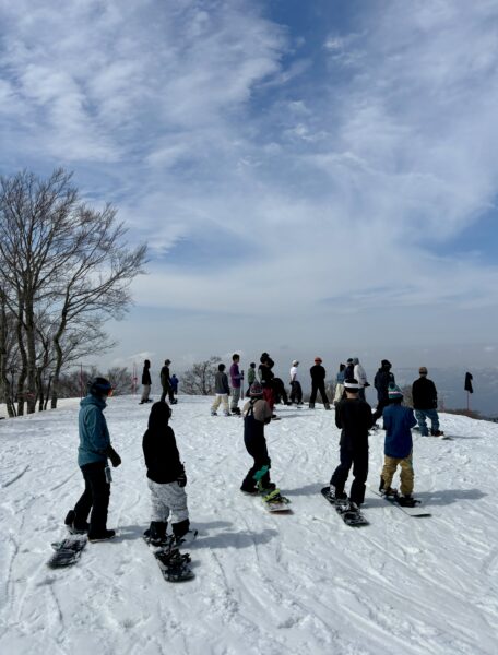 Snowboarders lining up for an epic run