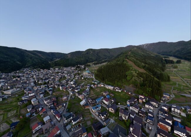 Golden Week in Nozawa Onsen with green scenery stretching across the valley