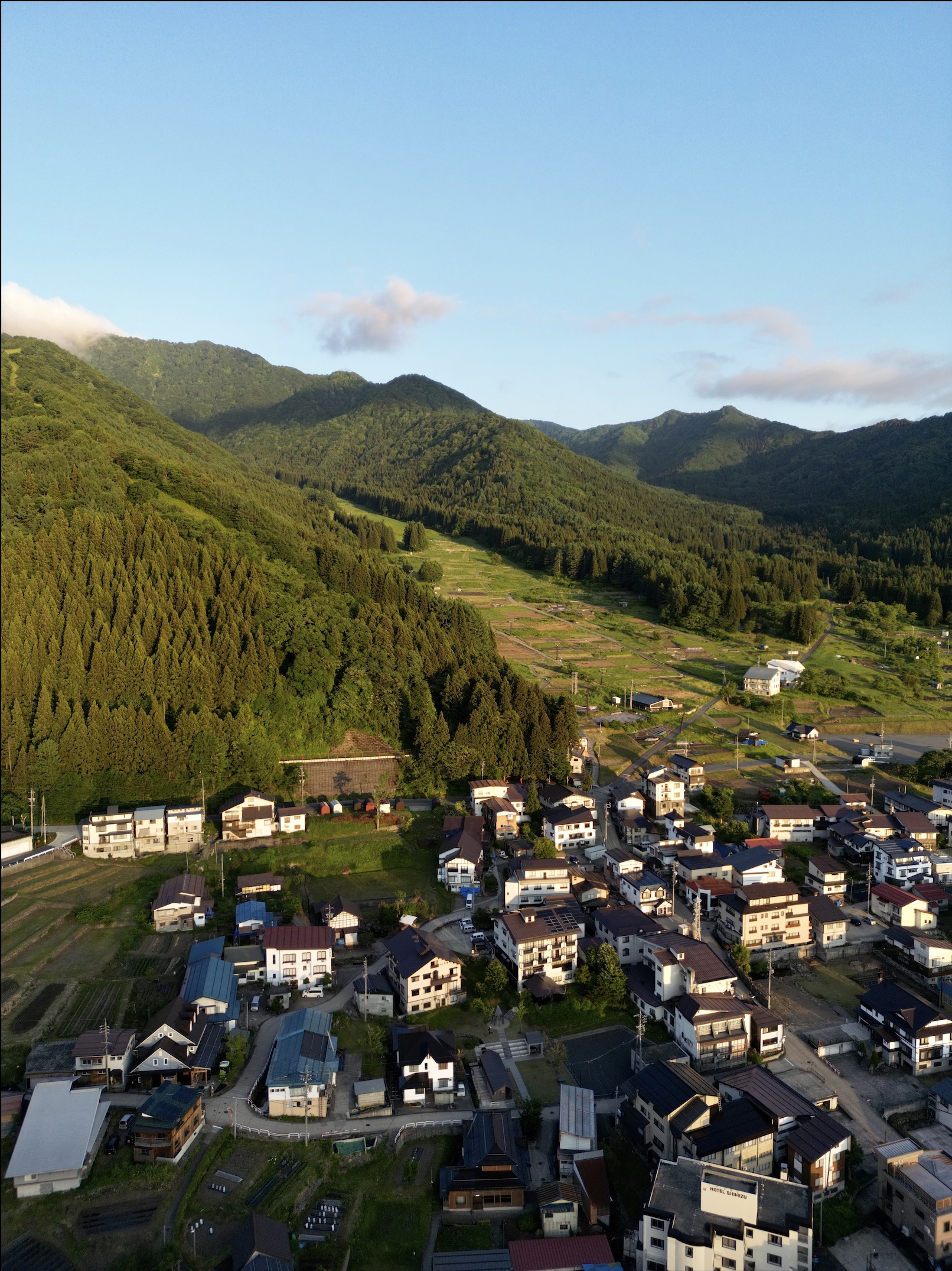 Blue skies and green heights stretch across Nozawa 