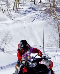 Ski mobil is the fastest way for Ski Patrol to move around the mountain in deep snow